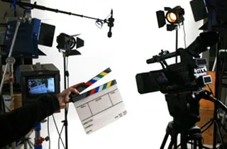 Professional video cameras and lighting on a production set